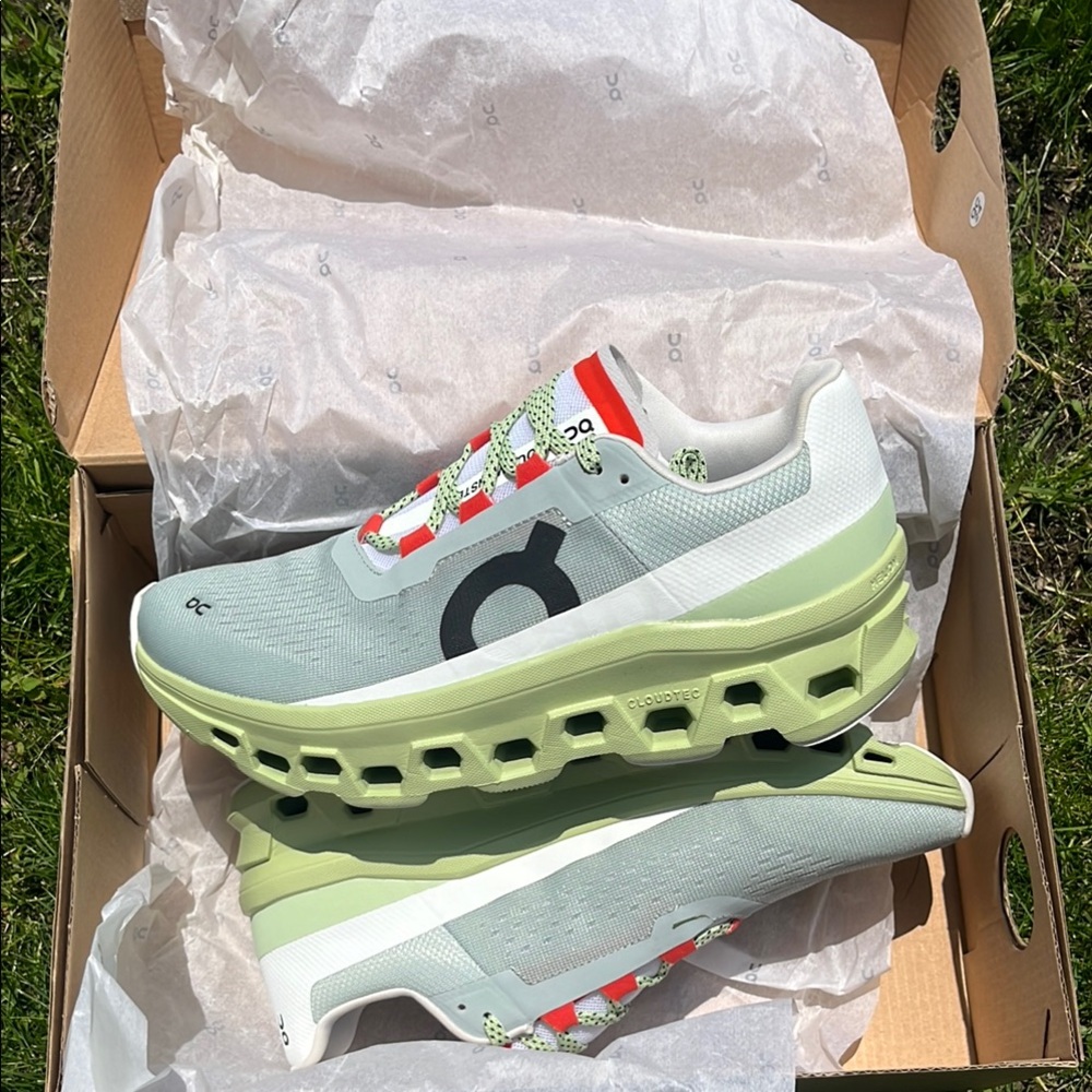 On Running Green and White Athletic Shoes with Cloud-Like Sole
